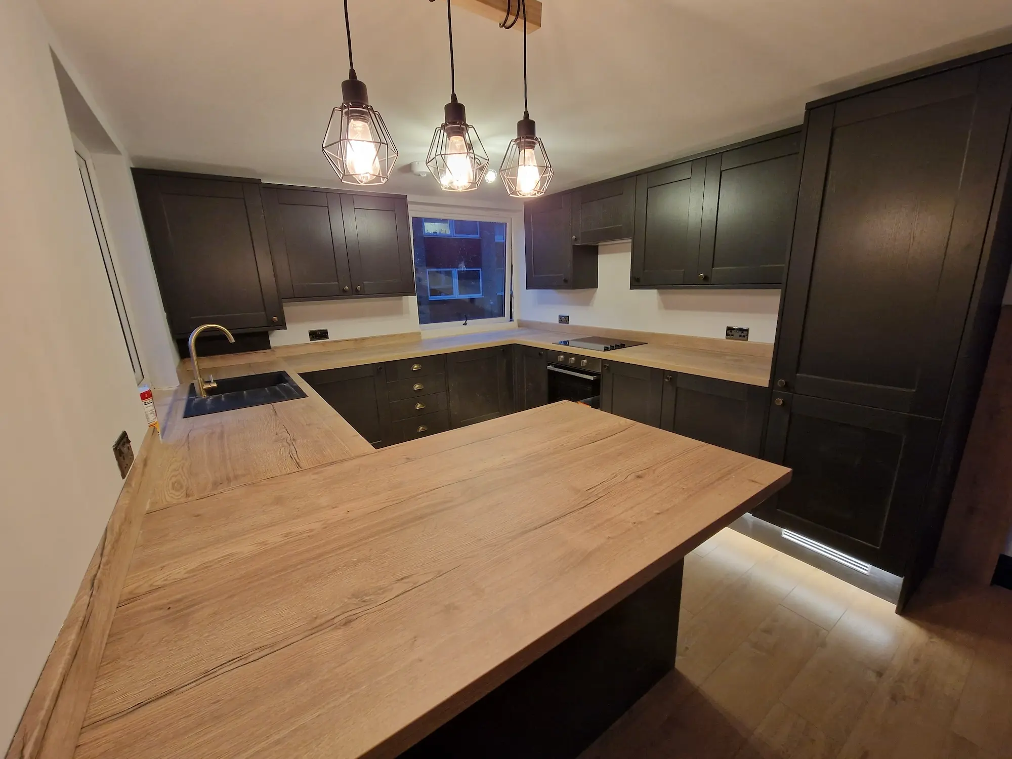 Another photo of the modern, dark-wooden kitchen of Farleigh Court Road 2 Bedroom Flat