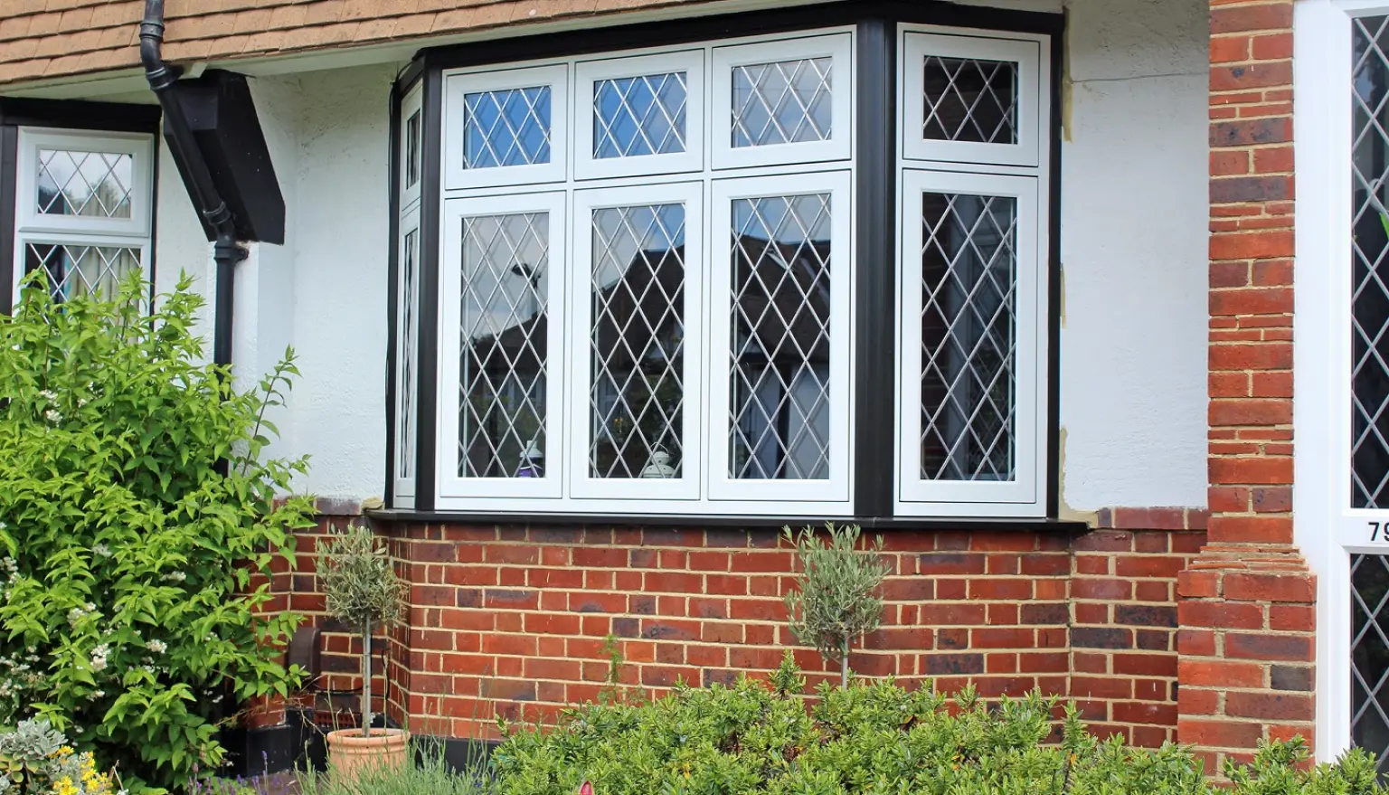 Photo of the outdoor of a house with a three sided window