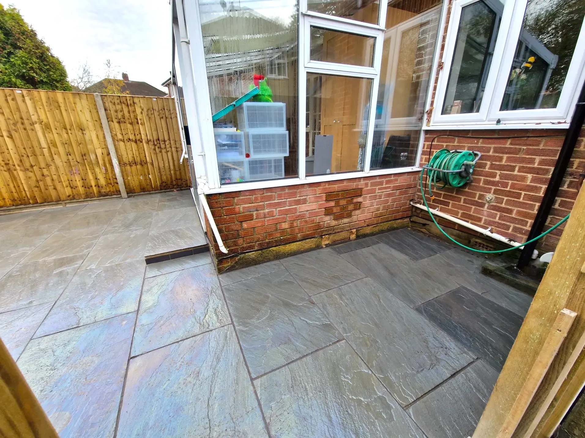 Photo of dark stone patio of a garden