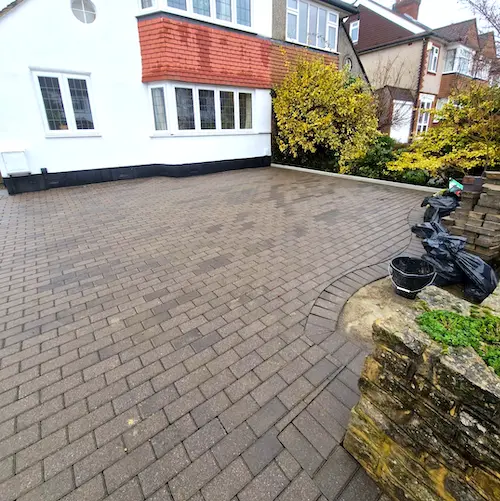 Photo of front brick patio driveway of a house